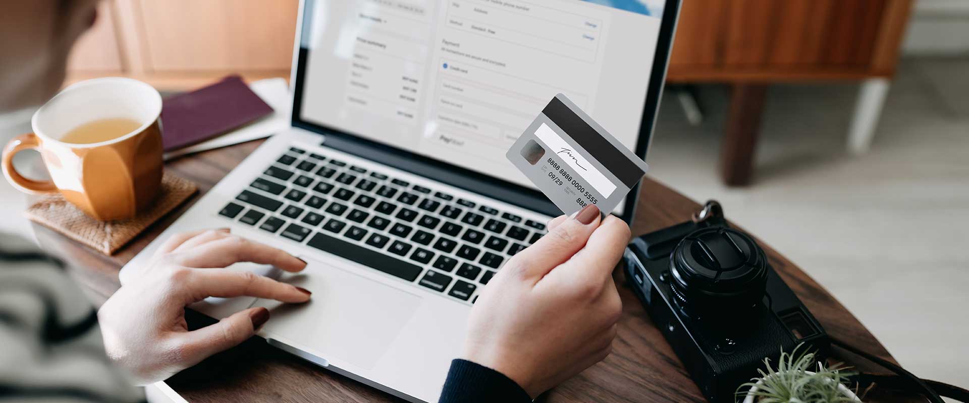 person with laptop and credit card