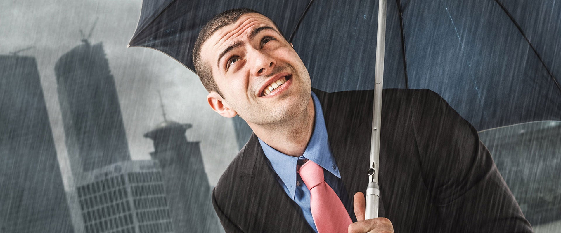 man with umbrella in rain