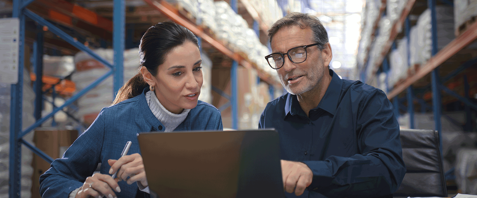 two people meeting in a warehouse
