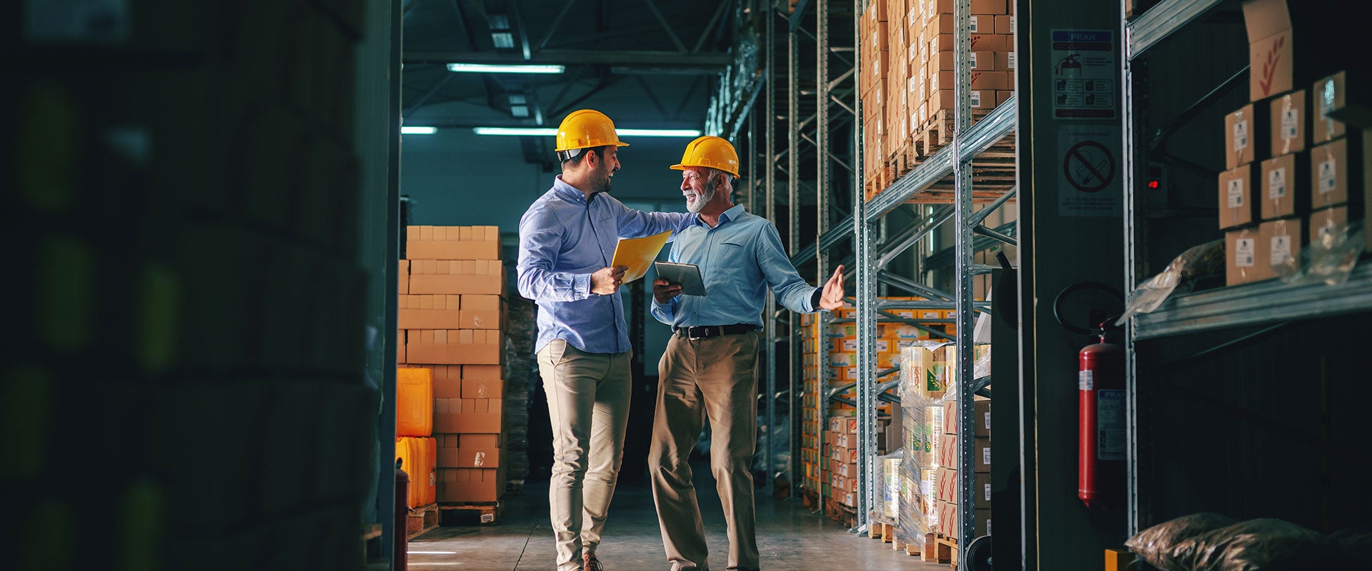 two industrial workers chatting