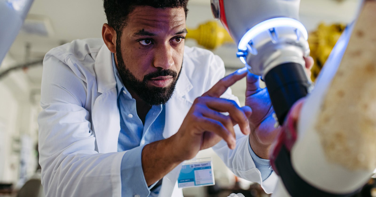 Man adjusting settings on xray machine