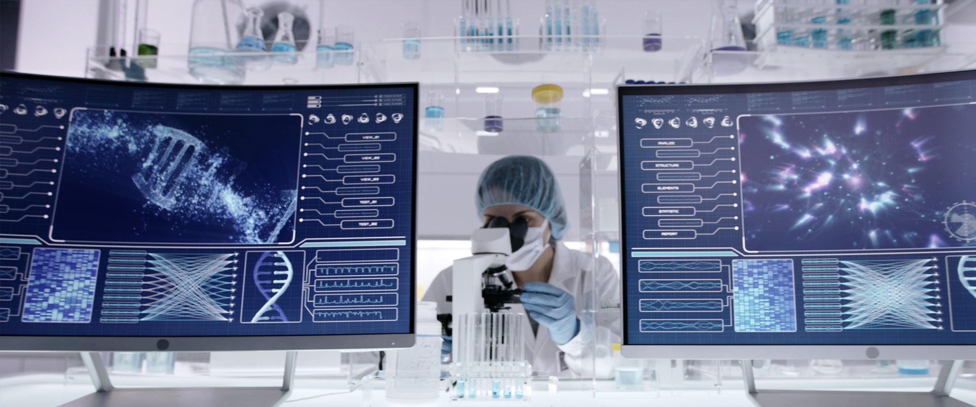Researcher looking through microscope