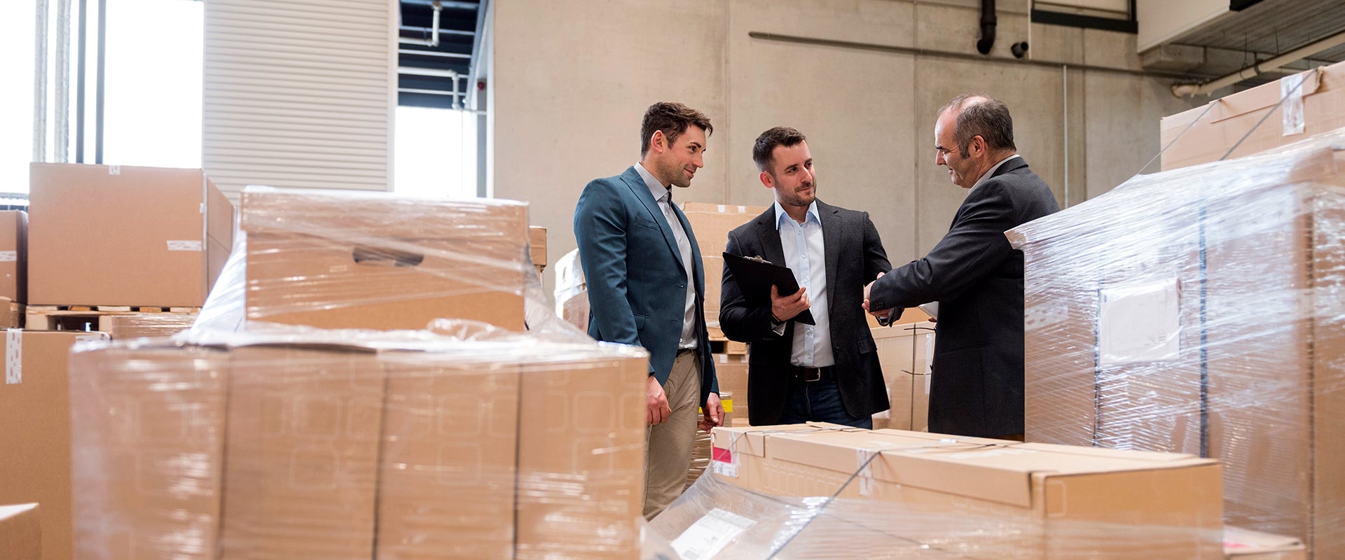 business handshakes in a storage warehouse