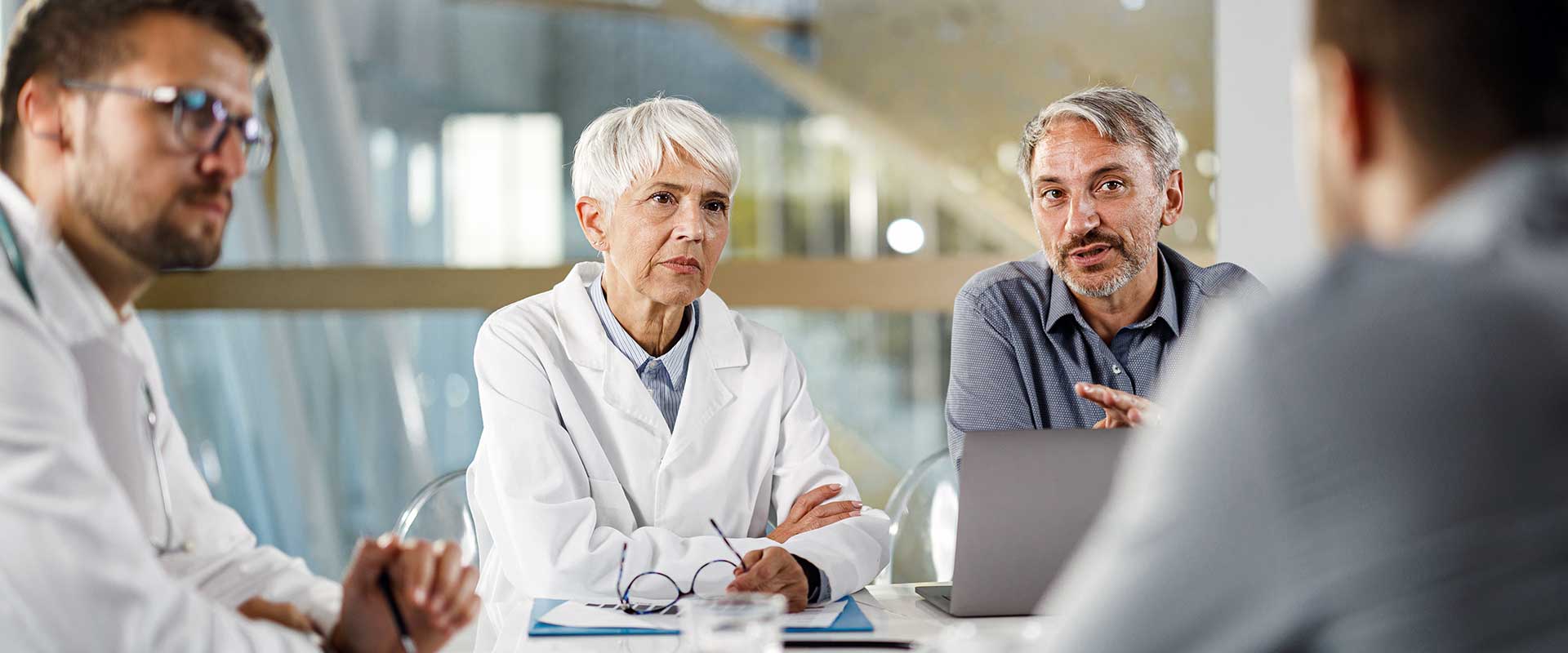 meeting between healthcare professionals and business partners