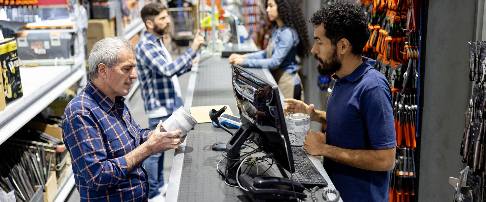 Man making a purchase in hardware store