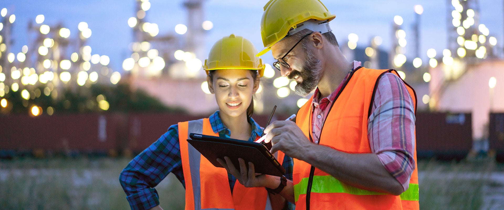 two construction workers smiling