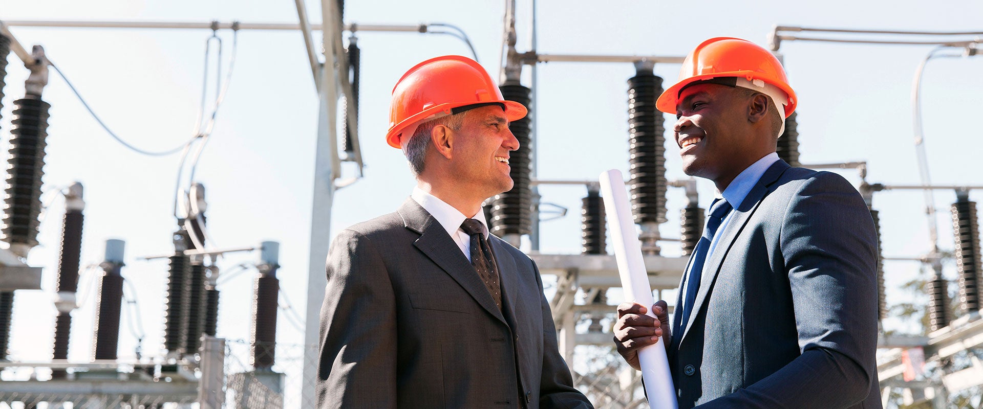 two men in suits and hardhats