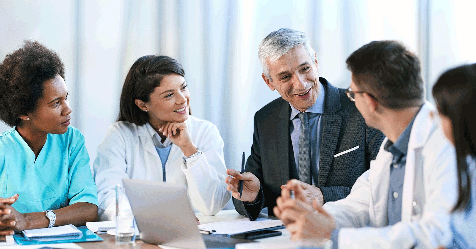 People sitting around conference table