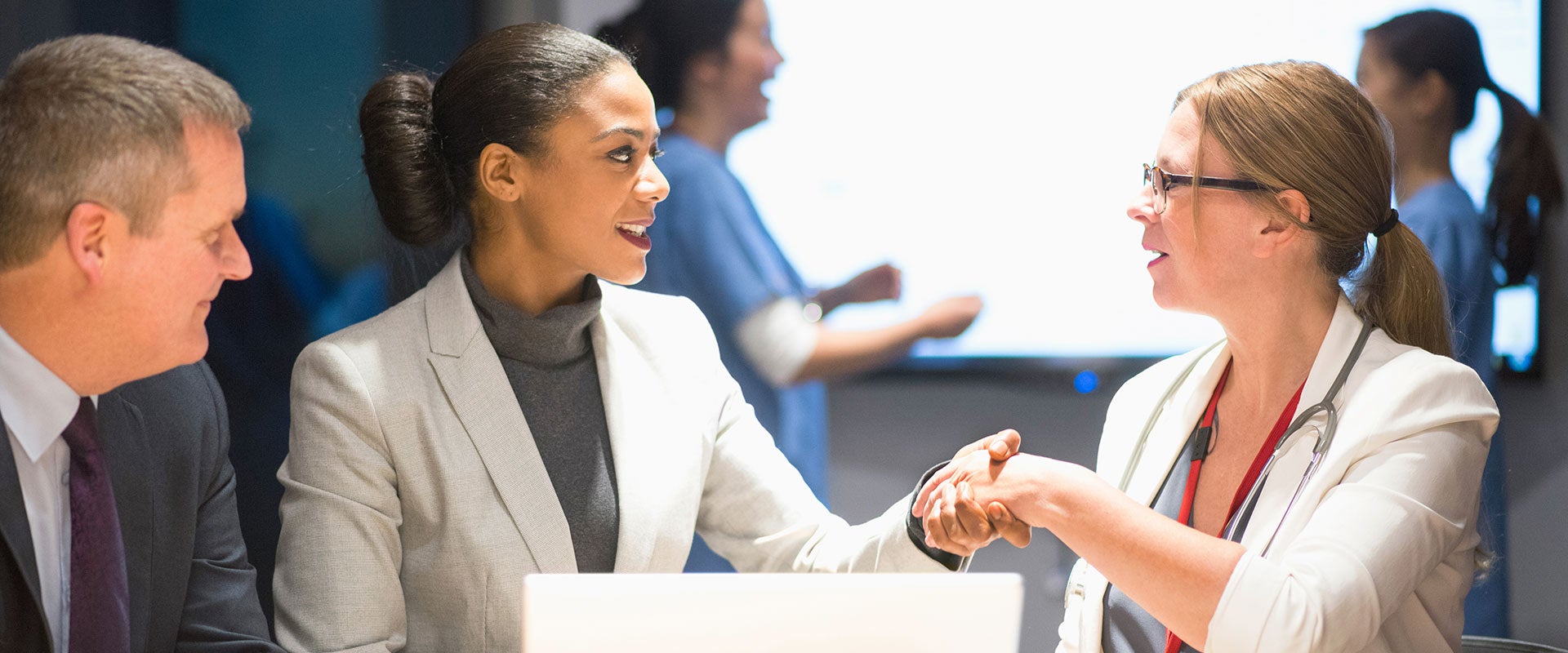 businesswomen shaking hands