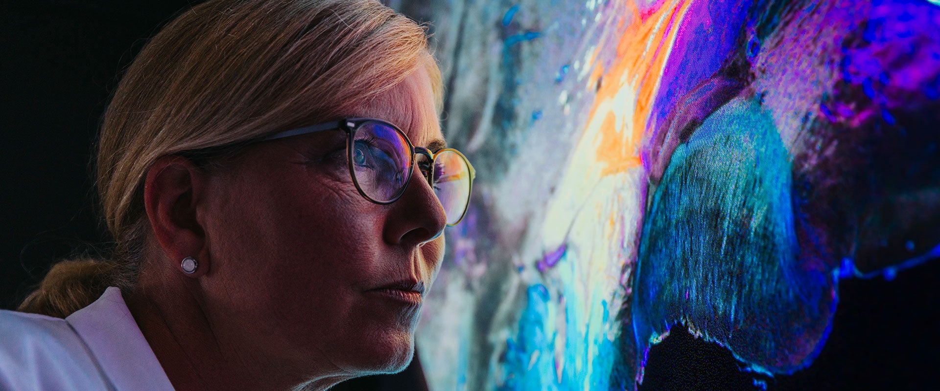 woman looking at colorful wave image