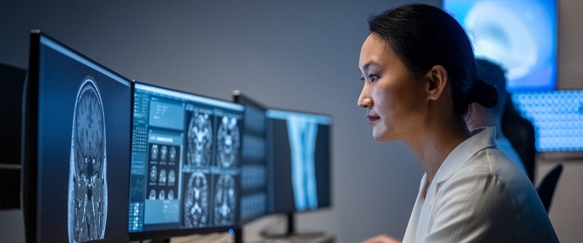 medical professional reviewing scans