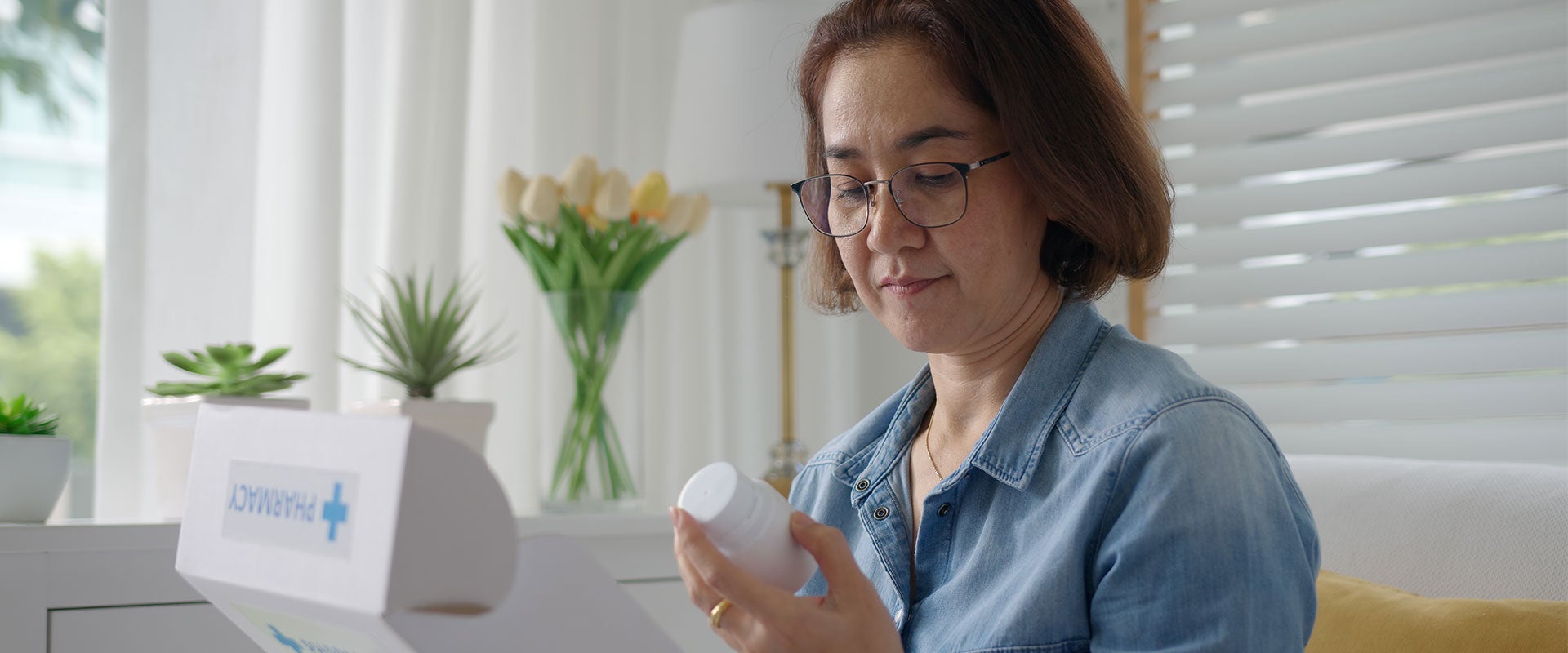 woman holding small bottle