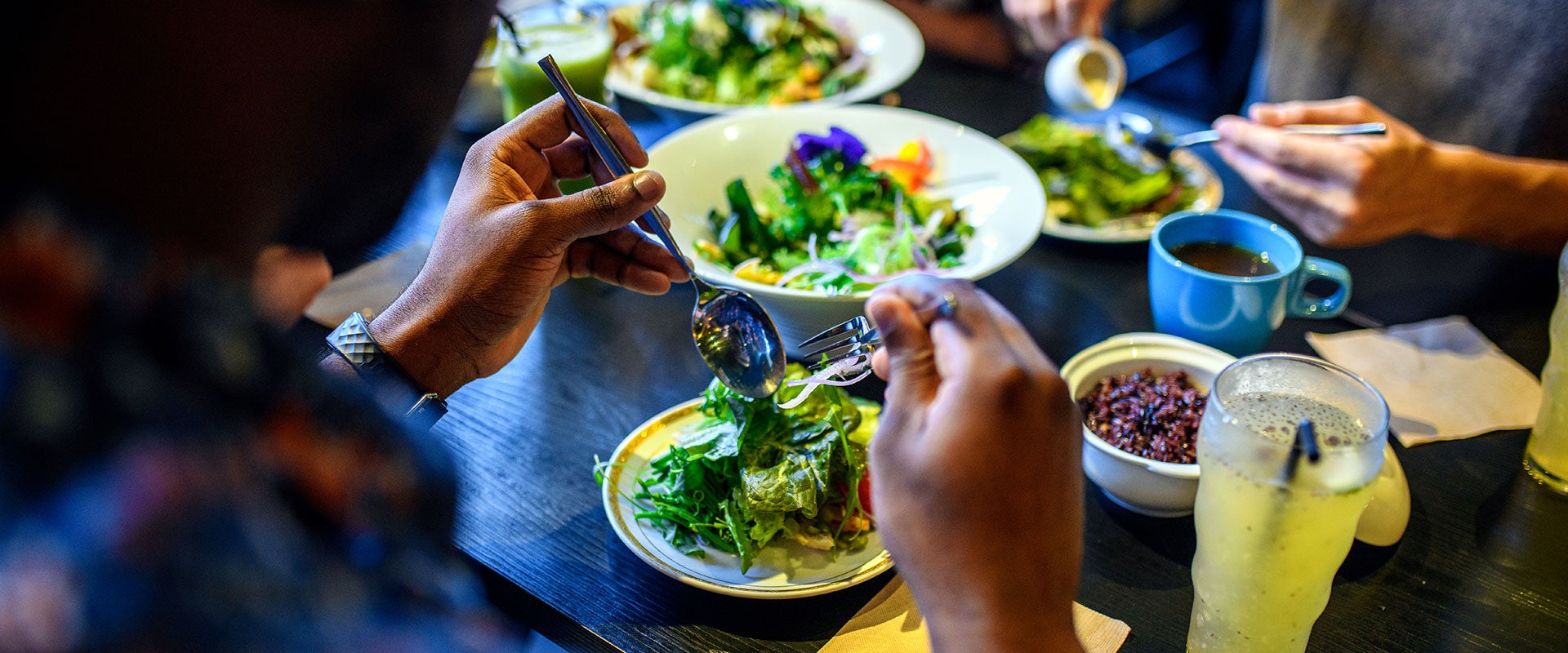 people sharing salad