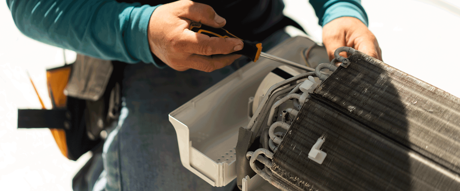 man cleaning out residential equipment