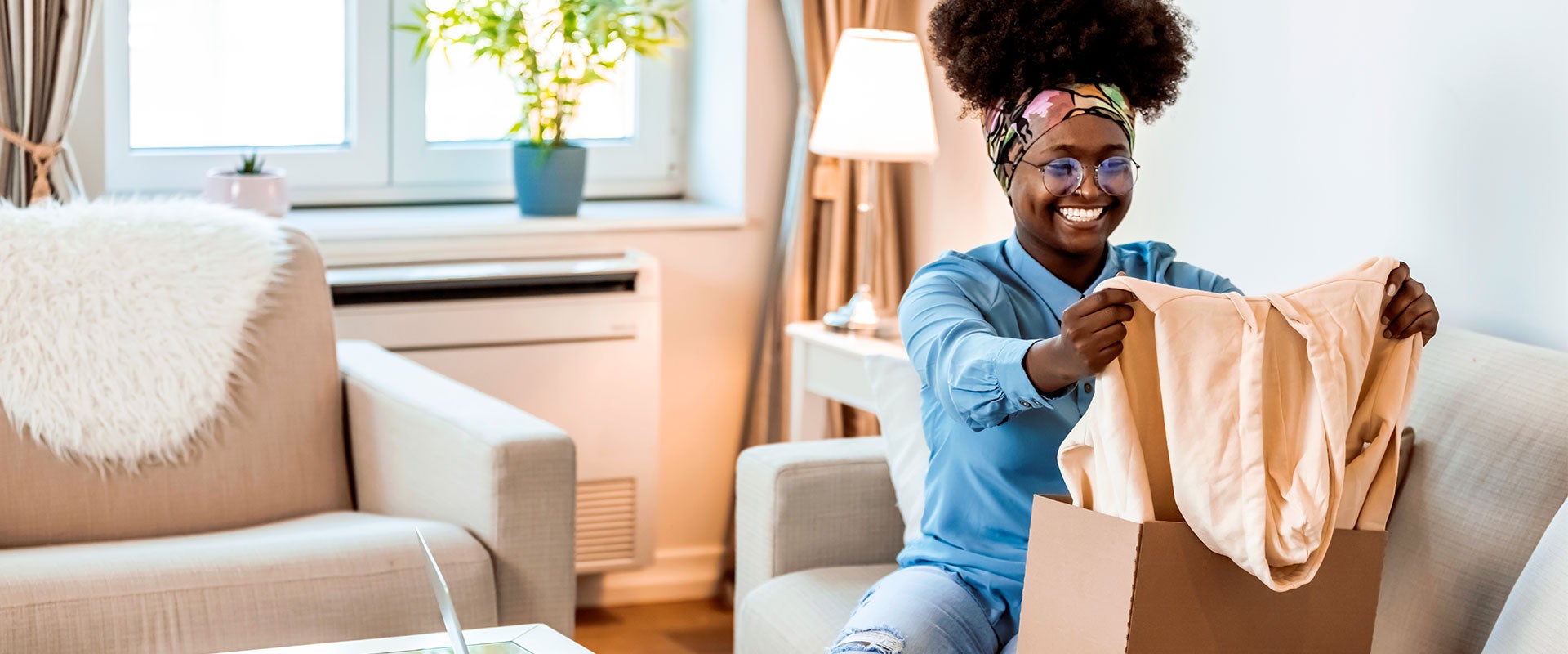 smiling woman holding shirt