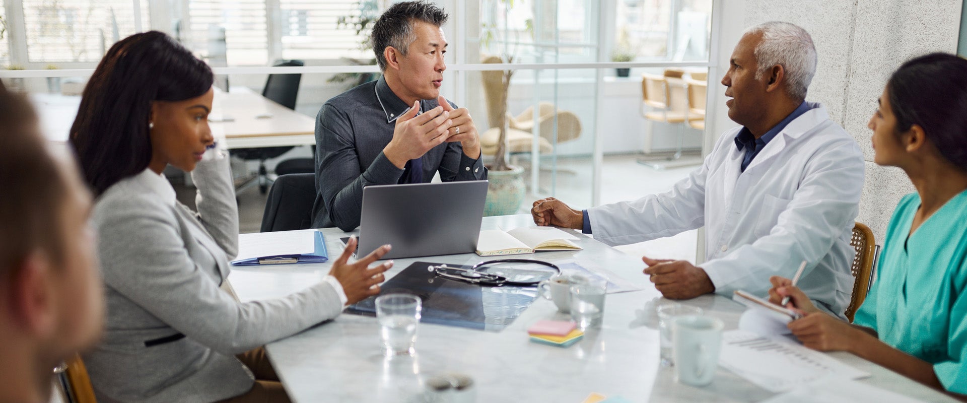 Medical professionals discussing healthcare in meeting