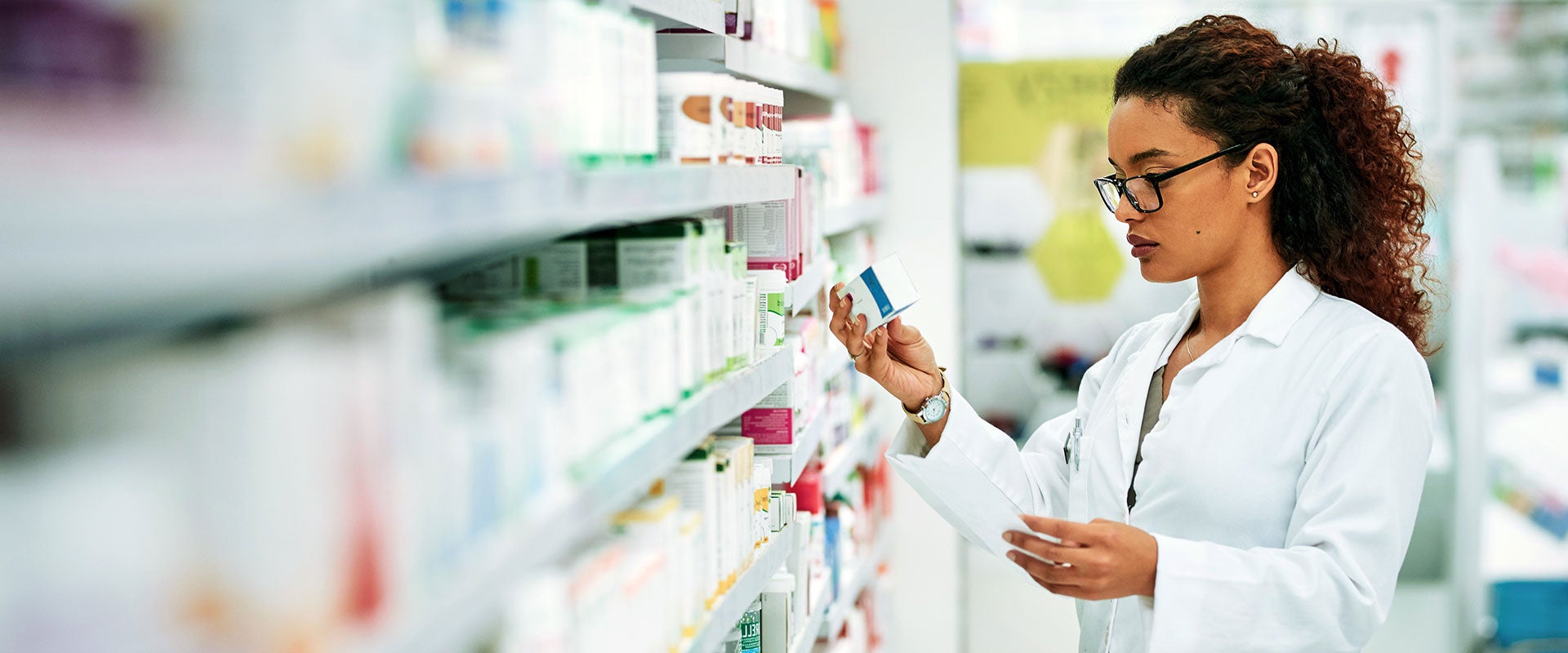 pharmacist viewing medicines