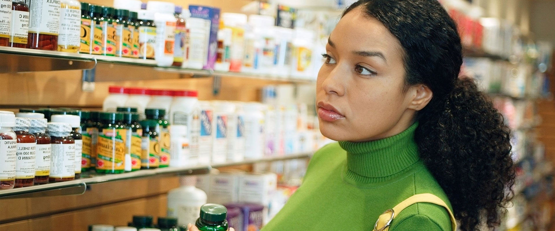 woman in supplement aisle