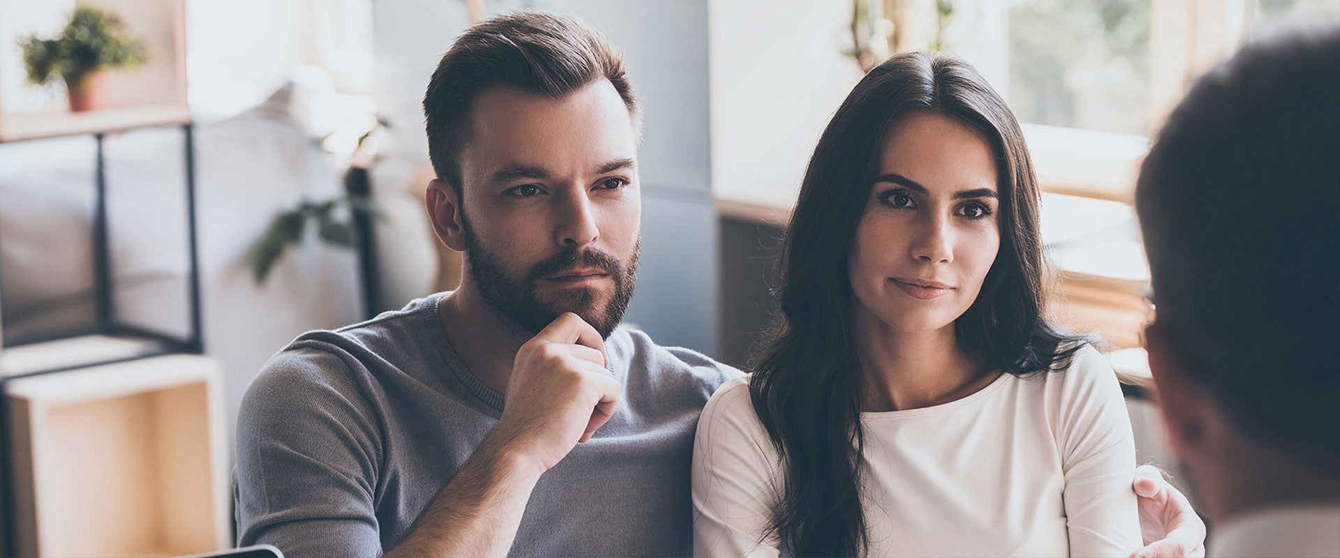 couple listening to speaker