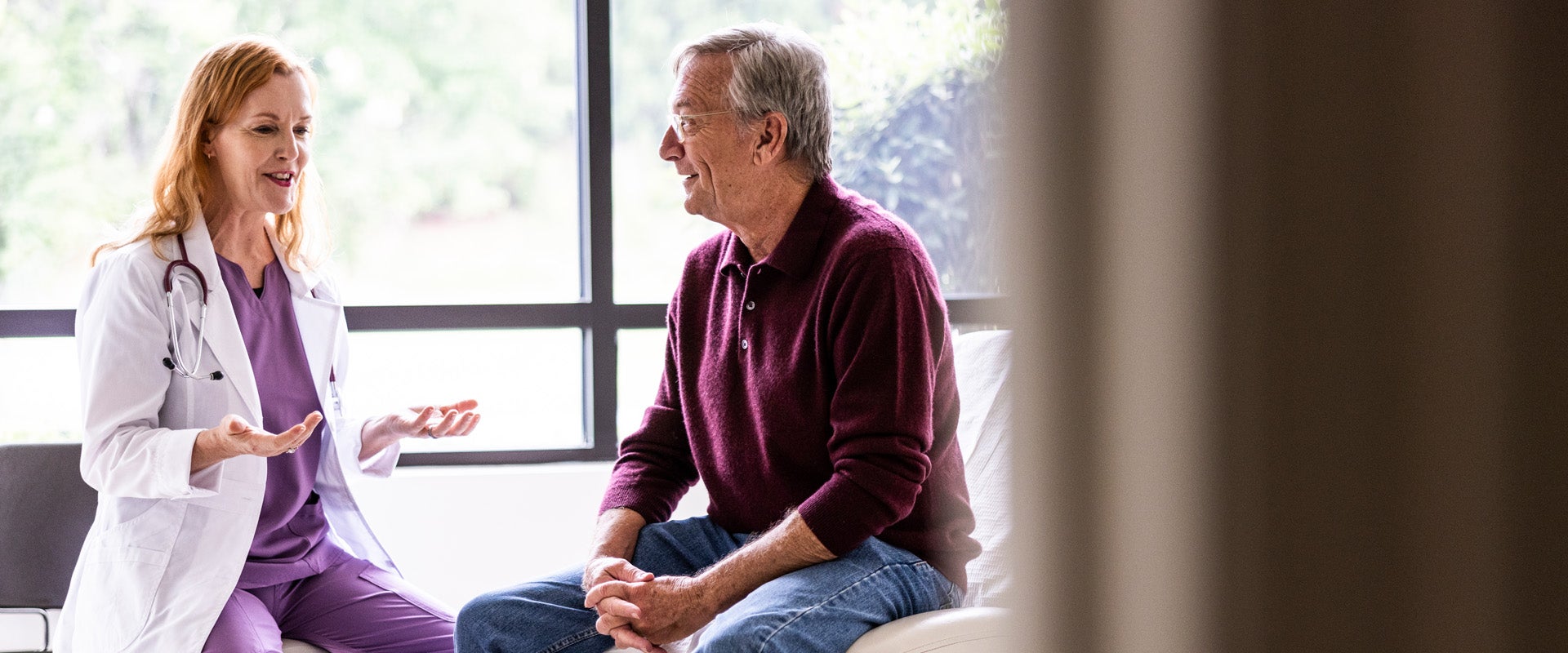 Physician talking with patient