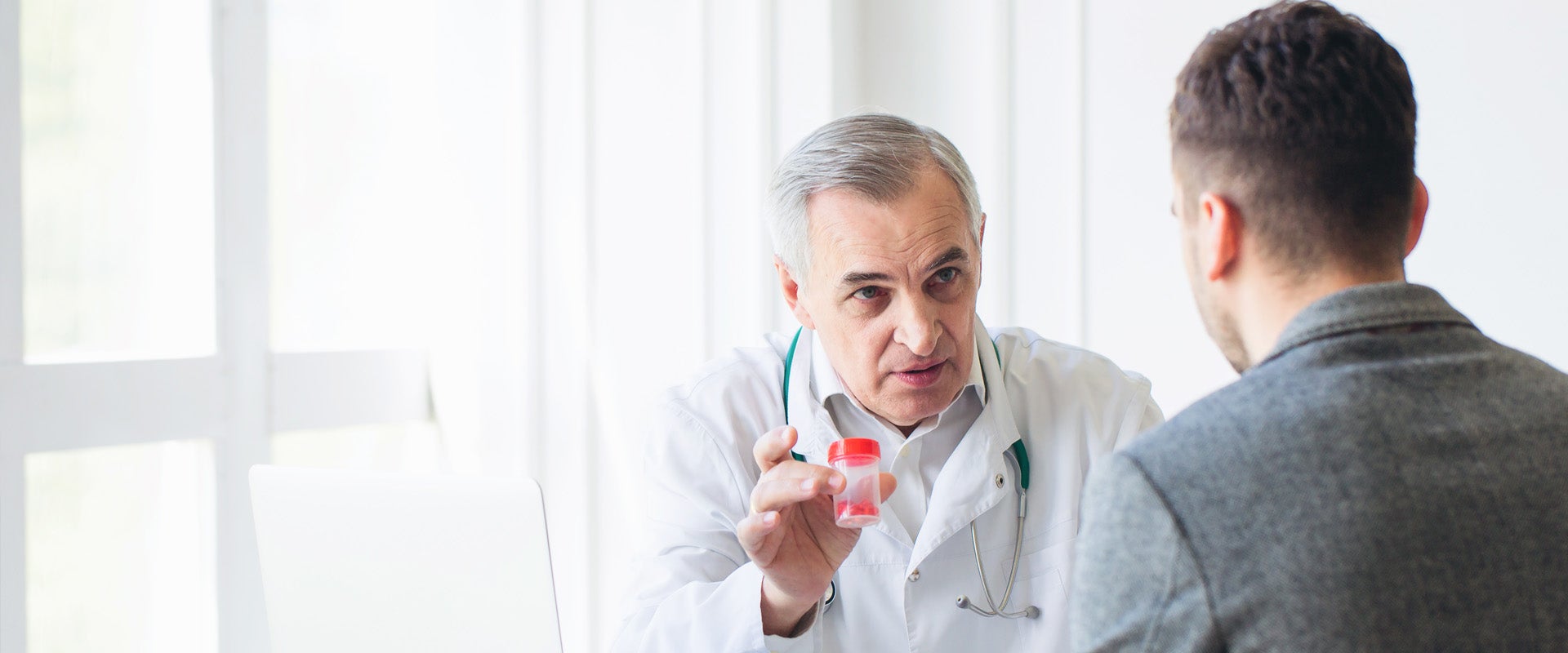Physician talking with patient