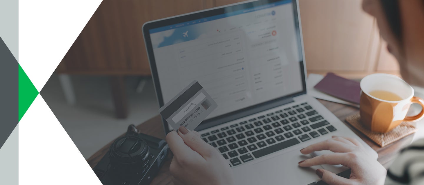 person online shopping with credit card in hand