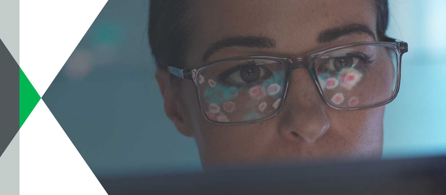 woman wearing glasses using computer
