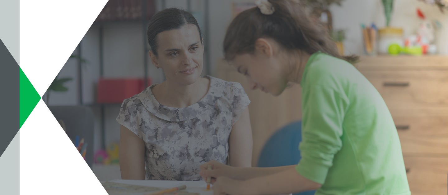 teacher and student in classroom