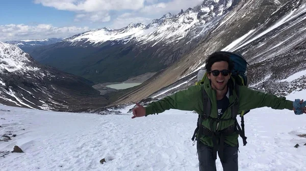 person hiking snowy mountain