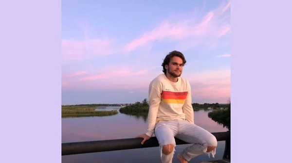 man in front of sunset