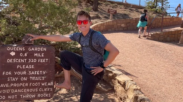 skyler in front of sign