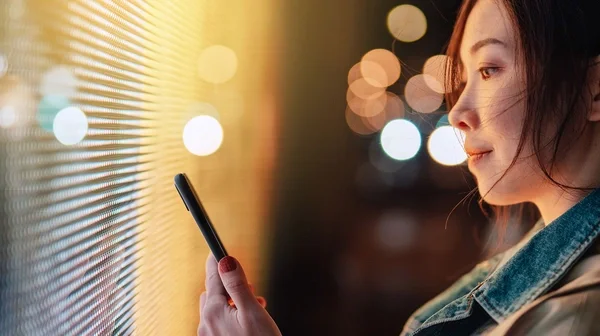 woman looking at screens