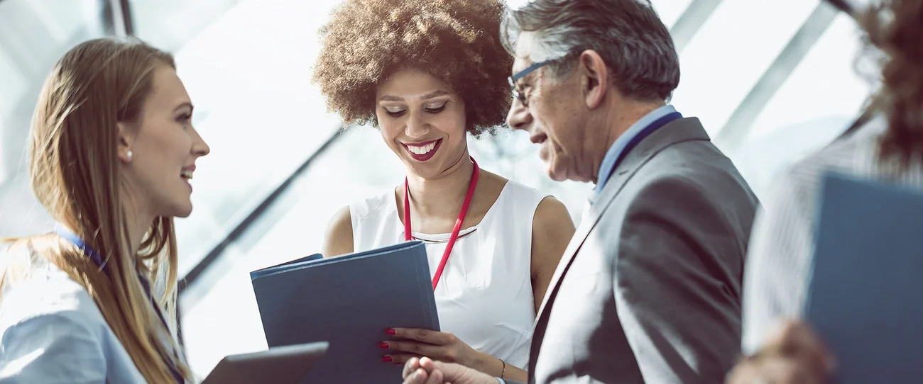 colleagues talking and smiling