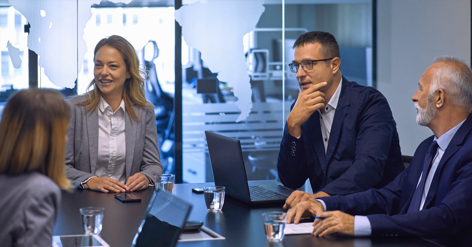 Executives meeting about supply chain growth