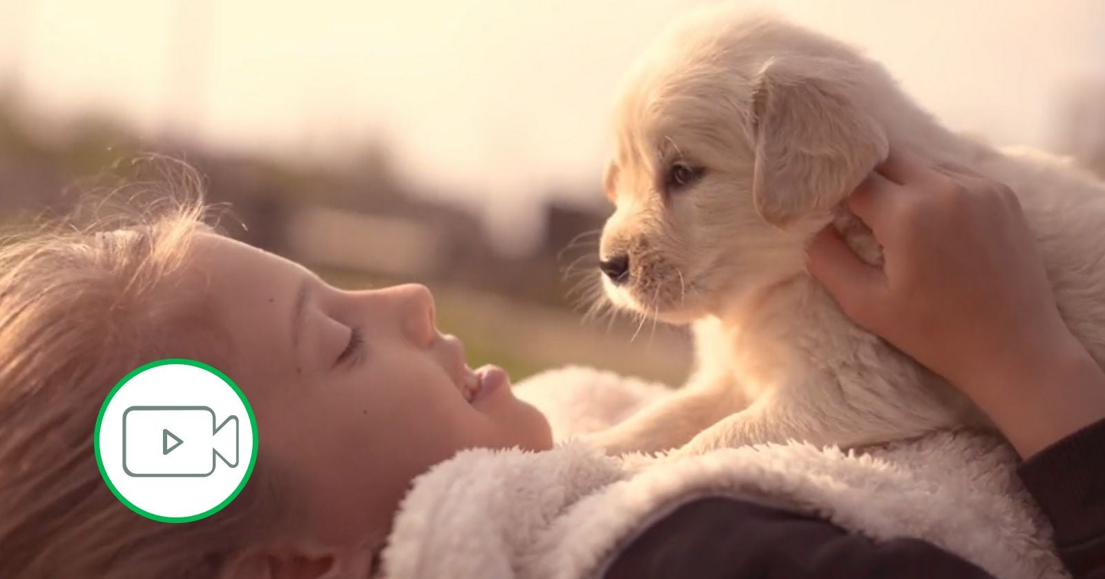 girl holding puppy