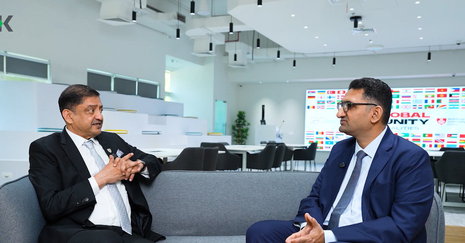 Two men discussing education