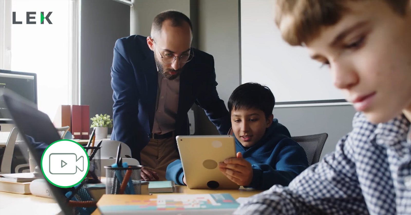 teacher helping young student