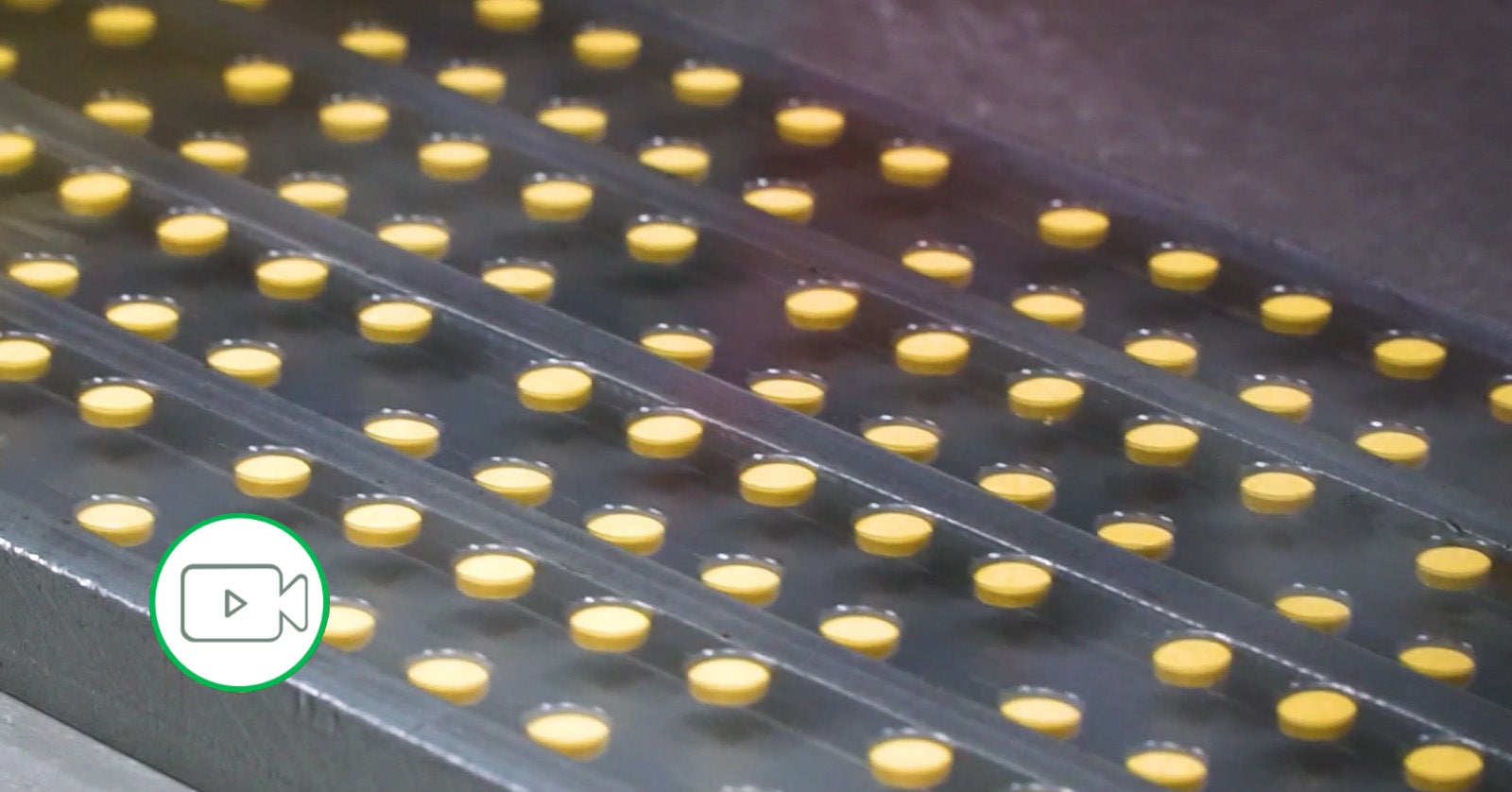 pills on a packaging conveyor belt
