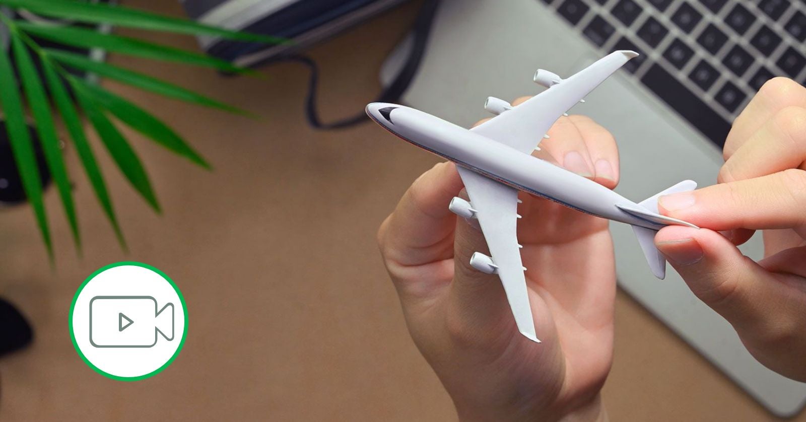 person holding model plane