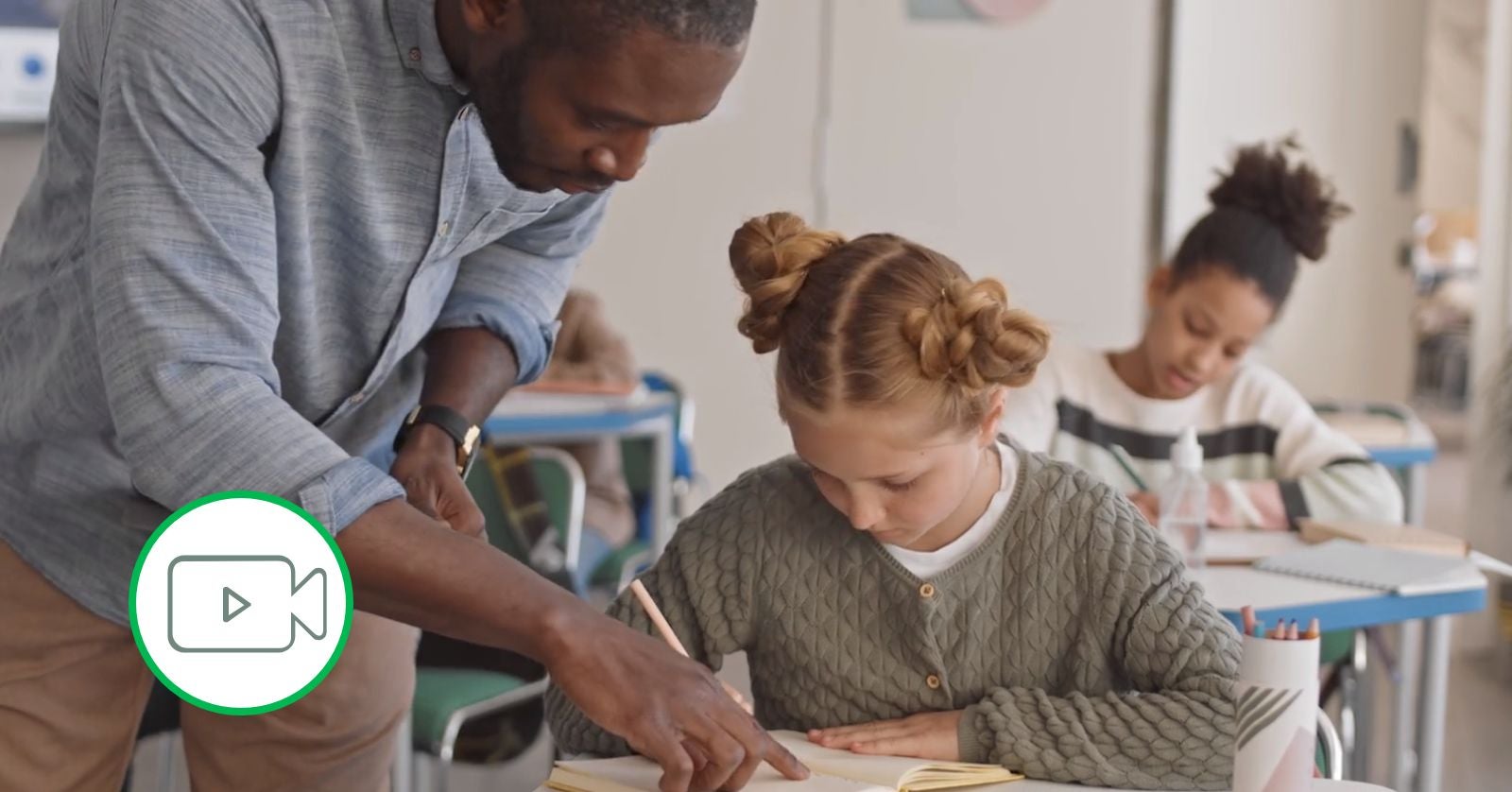 teacher helping student