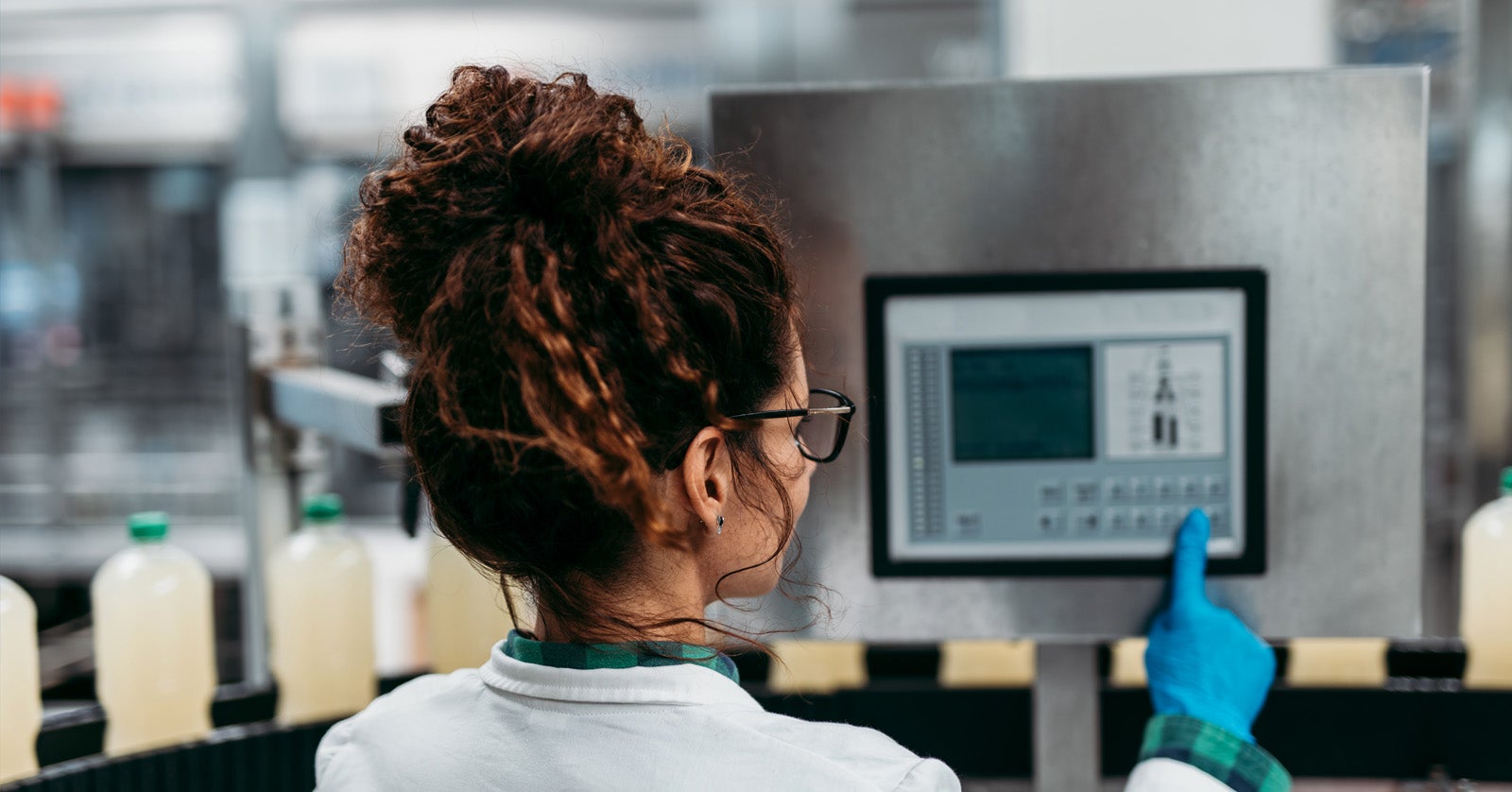 woman changing production panel