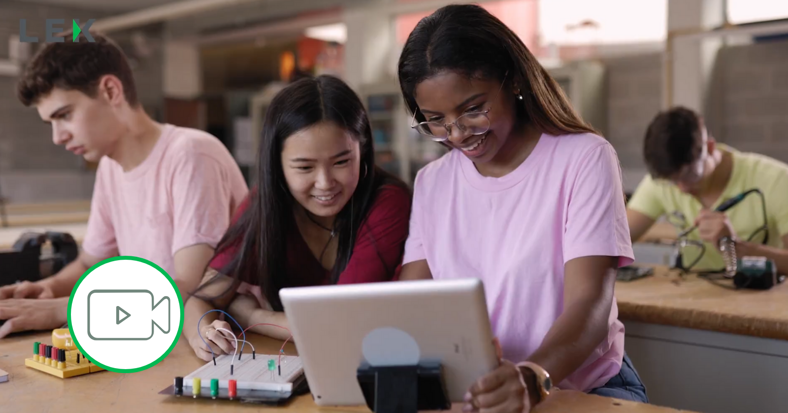 students sharing a laptop