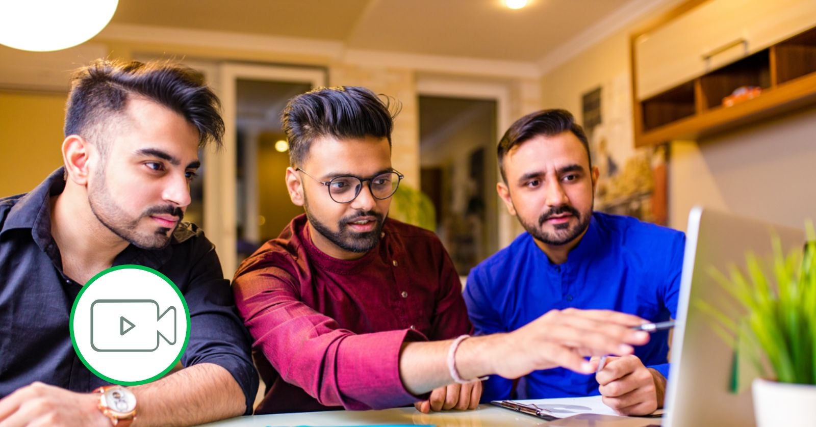 three men looking at the computer