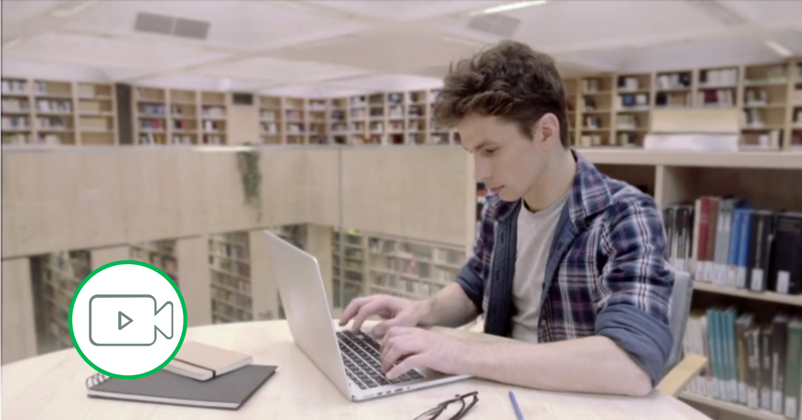 student on laptop in library